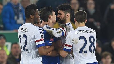 Chelsea's Diego Costa, second from right, and Everton's Gareth Barry clash in the incident leading to Costa's second yellow card during the English FA cup quarter-final football match at Goodison Park in Liverpool, north west England on March 12, 2016. AFP / Paul ELLIS