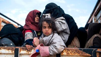 Civilians who fled from the embattled Baghouz area in the eastern Syrian province of Deir Ezzor sit in a truck during an operation by the US-backed Syrian Democratic Forces (SDF) to expel hundreds of Islamic State group (IS) extremists from the region. AFP