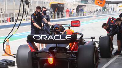 Red Bull's Dutch driver Max Verstappen waits in the pit during the second day of Formula One pre-season testing at the Bahrain International Circuit in the city of Sakhir on March 11, 2022. AFP