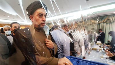 An Iranian cleric casts his vote for the the Islamic republic's presidential election at the Iranian embassy in Kuwait City. AFP