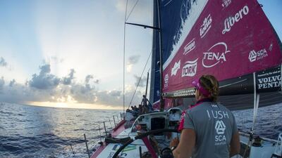Annie Lush of Team SCA helms through the light winds of the cold front's transition zone during the Volvo Ocean Race's sixth leg. Corinna Halloran / Team SCA / Volvo Ocean Race