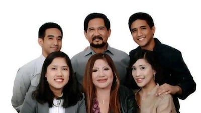 Lorna Lim Varona, centre, and some of her family. The businesswoman's body was found stuffed in a bag in her car.