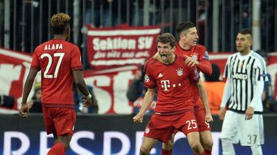 Bayern Munich's Thomas Muller celebrates after scoring the added-time equaliser against Juventus in the Champions League on Wednesday night. Andreas Gebert / EPA / March 16, 2016