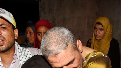 Freed Palestinian prisoner Ateya Abu Moussa, who was held by Israel for 20 years, hugs his aunt. REUTERS / Ibraheem Abu Mustafa