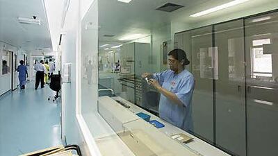 The unit is protected by guards, and patients and nurses are separated behind sealed doors.