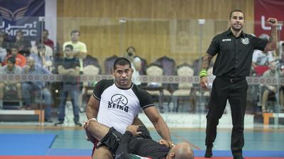Ricardo Evangelista, top, secured a double gold at the Dubai Jiu-Jitsu Open, winning his weight category and the open class. Mona Al-Marzooqi / The National