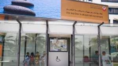 Passengers wait inside the air-conditioned bus shelter on Muroor Road.