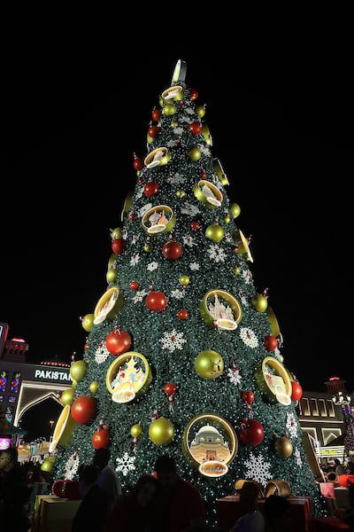 Global Village's 21-m-tall Christmas tree celebrates cultures from around the world. Pawan Singh / The National