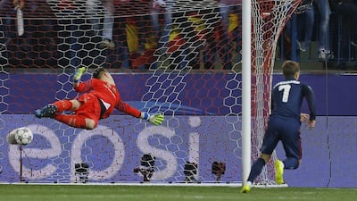 Atletico’s Antoine Griezmann, right, starts to celebrate after passing Barcelona’s goalkeeper Marc-Andre ter Stegen, left, and scoring his side’s first goal during the Champions League 2nd leg quarter-final match between Atletico Madrid and Barcelona at the Vicente Calderon stadium in Madrid, Spain, Wednesday April 13, 2016. (AP Photo/Francisco Seco)
