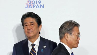 South Korean President Moon Jae-In, right, and Japanese Prime Minister Shinzo Abe, left, at the G20 summit in June in Osaka, Japan. Kim Kyung-Hoon / Getty