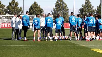 Zinedine Zidane, in white in the centre, oversees his first training session back as Real Madrid manager. EPA