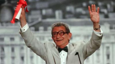 Youssef Chahine reacts after winning the Cannes film festival 50th anniversary award for his life's work.
