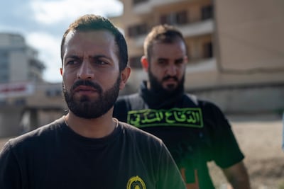 Hussein Jaber, a volunteer for the Lebanese civil defence, grieves his colleague who was killed by an Israeli strike near their station in Nabatieh, south Lebanon on Wednesday.