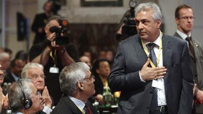 Front row, left to right, Saudi Arabia’s oil minister Ali Al-Naimi, Opec secretary general Abdullah Al-Badri and Iraq’s oil minister Abdul Kareem Luaibi. Heinz-Peter Bader / Reuters