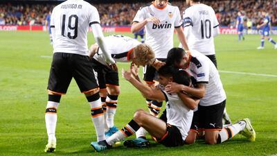 Valencia's players celebrate after Carlos Soler opened the scoring. AP