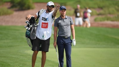 DUBAI, UNITED ARAB EMIRATES - NOVEMBER 16: Danny Willett of England and his caddie look along the 1st hole fairway during day two of the DP World Tour Championship at Jumeirah Golf Estates on November 16, 2018 in Dubai, United Arab Emirates. (Photo by Ross Kinnaird/Getty Images)