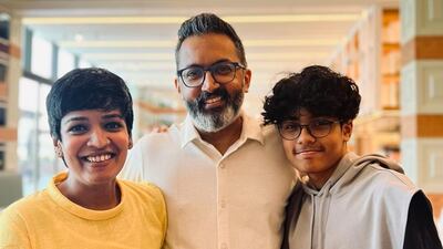 Sneha May Francis with her husband Markos Abraham and son Rafael Francis Abraham. Sneha May Francis / The National