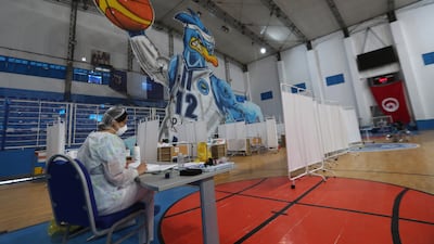A nurse works in a basketball hall that was converted into makeshift hospital to deal with a surge in Covid-19 infections in Tunis. EPA