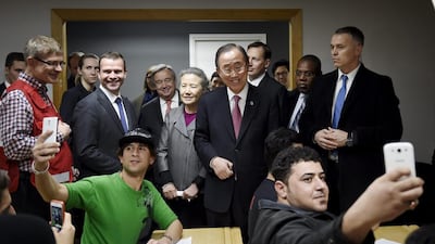 The UN Secretary General Ban Ki-moon, centre, visits a reception centre for asylum seekers with the Finnish minister of the interior Petteri Orpo, second left, in Vantaa, Finland. Antti Aimo-Koivisto / Lehtikuva / AFP Photo