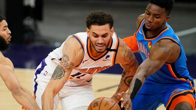 Phoenix Suns forward Abdel Nader battles Oklahoma City Thunder guard Hamidou Diallo for the ball. AP