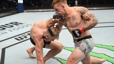 Jimmy Crute punches Modestas Bukauskas during their light heavyweight bout at UFC Fight Night. Getty
