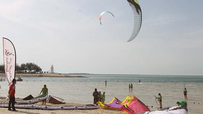 Participants get ready to kite surf at the Al Gharbia Watersports Festival in the Western Region.