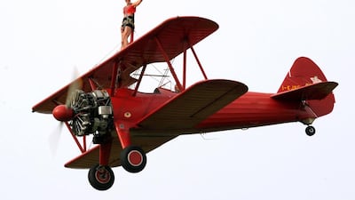 A wing-walker prerforms during a World Air Games performance (AFP / GIUSEPPE CACACE)