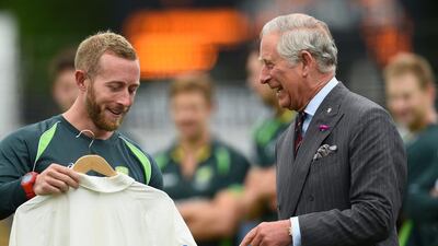 Prince Charles is given an Australia team shirt by team manager Gavin Dovey during a meeting on Monday in Cardiff ahead of the 2015 Ashes series. Stu Forster / Getty Images