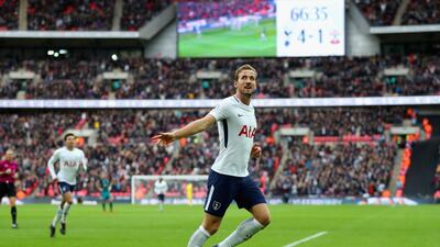 Harry Kane celebrates after scoring Tottenham's fifth goal to complete his hat-trick against Southampton on Tuesday. Catherine Ivill / Getty Images