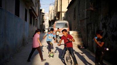 Palestinian refugee children at Al Baqaa camp, near Amman. New legislation aims to streamline existing children's rights in Jordan, say backers. Reuters