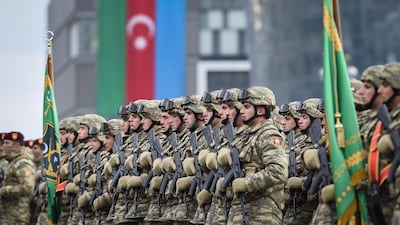 Azerbaijani soldiers during a military parade dedicated to the victory in the Nagorno-Karabakh armed conflict, in Baku, Azerbaijan, on December 20, 2020. EPA