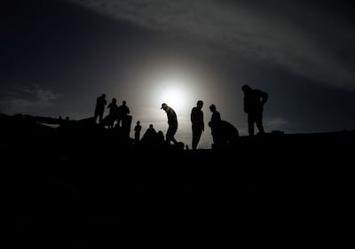 Palestinians inspect damage following an Israeli air strike in Rafah on Sunday. Reuters