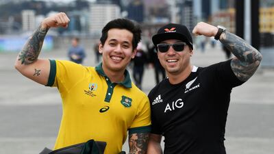Rival fans pose for a photo as they arrive at the stadium ahead of during the Bledisloe Cup rugby game between the All Blacks and the Wallabies in Wellington, New Zealand. AP Photo