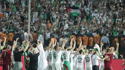 Algeria's players acknowledge their fans in Cairo. EPA