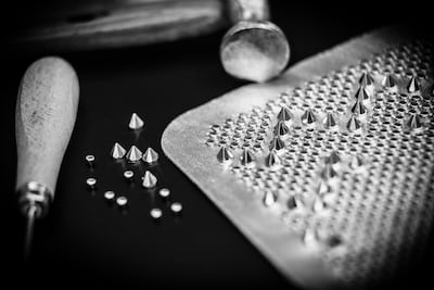 The ornamentation is a combination of flat, round and pyramidal studs