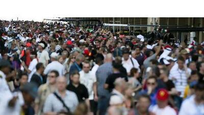 Grand Prix weekend revs up: Formula One fans walk on the track and pit lane at Yas Marina Circuit yesterday.