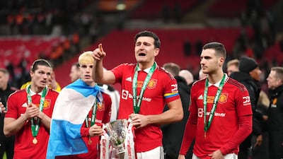 Manchester United's club captain Harry Maguire celebrates with teammates. PA