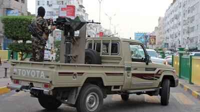 Yemeni loyalist fighters, backed by Saudi Arabia and the UAE, patrol the streets of central Aden on June 11, 2018. Saleh Al Obeidi / AFP