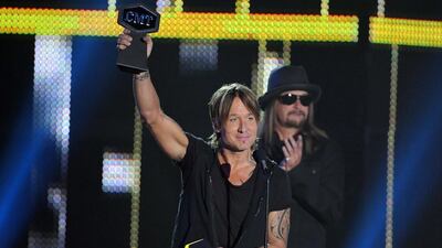 Keith Urban accepts the Video of the Year award for Blue Ain't Your Color. Harrison McClary / Reuters
