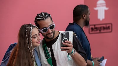 Plenty of selfies being taken against the colourful backdrop