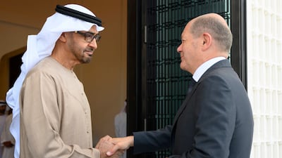 President Sheikh Mohamed shakes hands with German Chancellor Olaf Scholz, at Al Shati Palace in Abu Dhabi. Photo: UAE Presidential Court