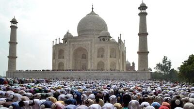 Indian Muslims offer prayers in the premises of the Taj Mahal in Agra, India, Saturday, July 18, 2015. Millions of Muslims across the world are celebrating the Eid Al Fitr holiday, which marks the end of the month-long fast of Ramadan. Pawan Sharma / AP photo
