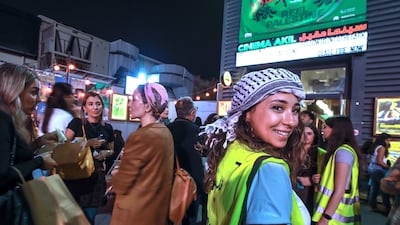 Volunteers helping with crowd control outside Cinema Akil before a screening