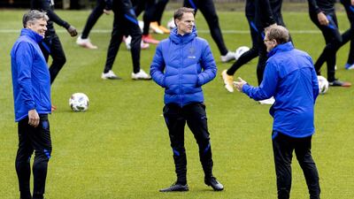 Netherlands' head coach Frank de Boer, centre, and his assistant Dwight Lodewege, right, take part in a training session. AFP