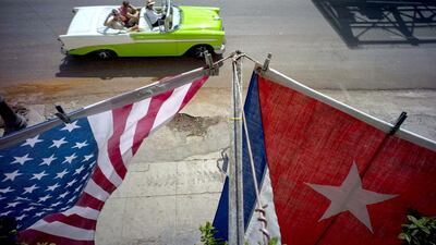 A US and a Cuban national flag hang from a Havana balcony to mark the restored full diplomatic relations between Cuba and the Unites States. Ramon Espinosa / AP Photo