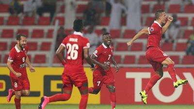 Rodrigo Lima, right, of Al Ahli celebrates a goal against Naft Tehran in the Asian Champions League quarter-final second leg in Dubai. Ashraf Al Amra / Al Ittihad / September 16, 2015