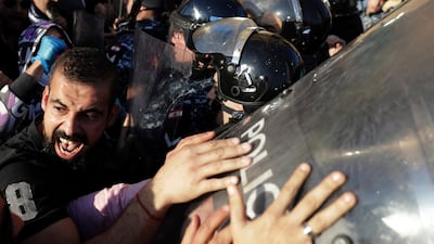 Scuffles have broken out in central Beirut as hundreds of anti-government protesters tried to prevent lawmakers from reaching Parliament.