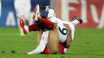 Shojae Khalilzadeh of Perseolis and Ryota Nagaki of Kashima Antlers get tangled during the Asian Champions League final second leg. Getty Images