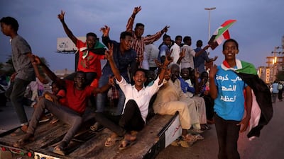 Sudanese people celebrate after the signature of the power sharing agreement between the opposition and the military in Khartoum, Sudan. EPA/MORWAN ALI