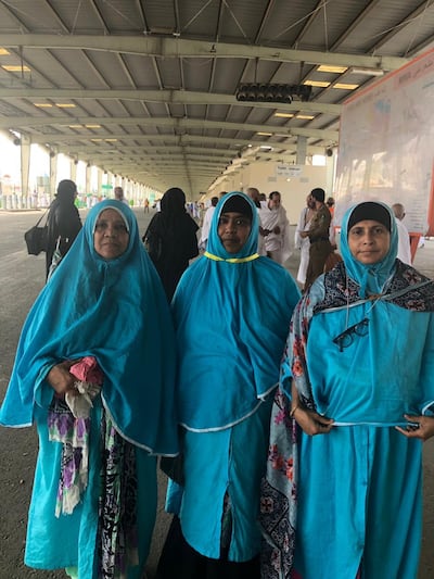 Female pilgrims stop to pose for a photo on their way to Mina. Balquees Basalom / The National